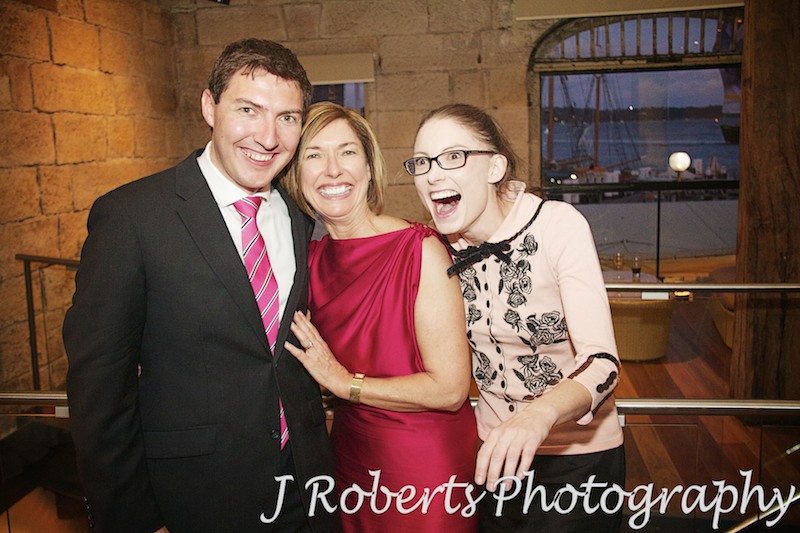 Groom with mother and sister laughing - wedding photography sydney
